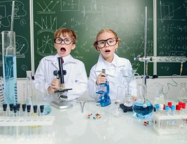 Engineering experiments in a lab coat and safety goggles