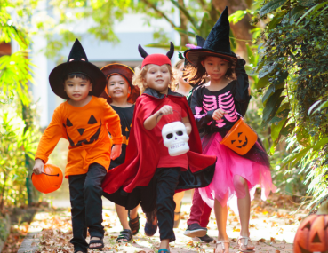 Kids having fun in costumes on Halloween