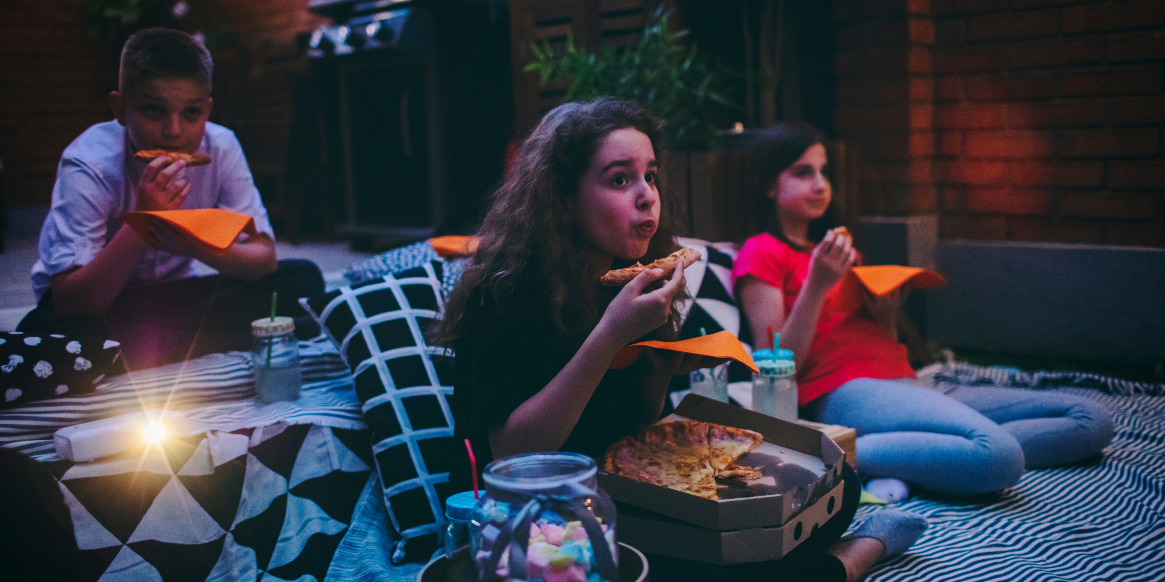 Children watching spooky movies for Halloween