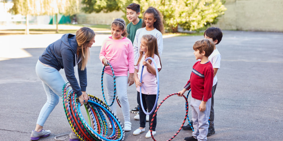 A lively group of children laughing and playing an interactive icebreaker game, designed to help kids feel comfortable and make new friends.