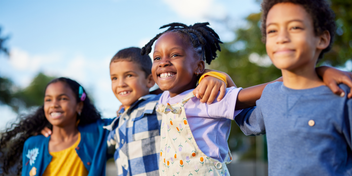 A group of kids talking and engaging in an icebreaker activity, helping them get to know each other in a fun and relaxed way.