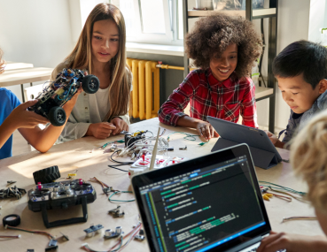 A group of kids exploring science through hands-on experiments, showcasing how STEM learning videos can make education exciting and interactive at home.